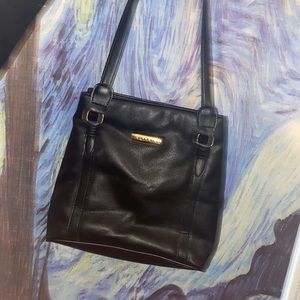 Nice black tote. Goes with everything. Very vintage . And waiting for u.